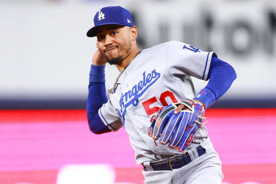 MIAMI, FLORIDA - SEPTEMBER 06: Mookie Betts #50 of the Los Angeles Dodgers throws to first base for an out against the Miami Marlins during the third inning at loanDepot park on September 06, 2023 in Miami, Florida. (Photo by Megan Briggs/Getty Images)